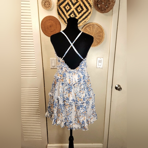 LAST ONE! Blue And White Floral Mini Dress With Ruffles And Criss-Cross Back - Picture 9 of 11